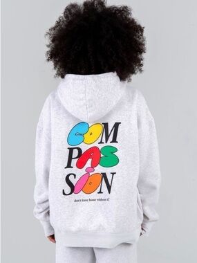 Mayfair Group “Compassion don’t leave home without it” hoodie unisex one size